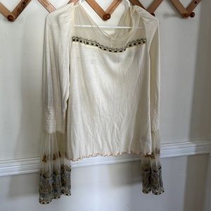 Free People fitted top with flowy, sleeves and mesh neckline. *only worn once*